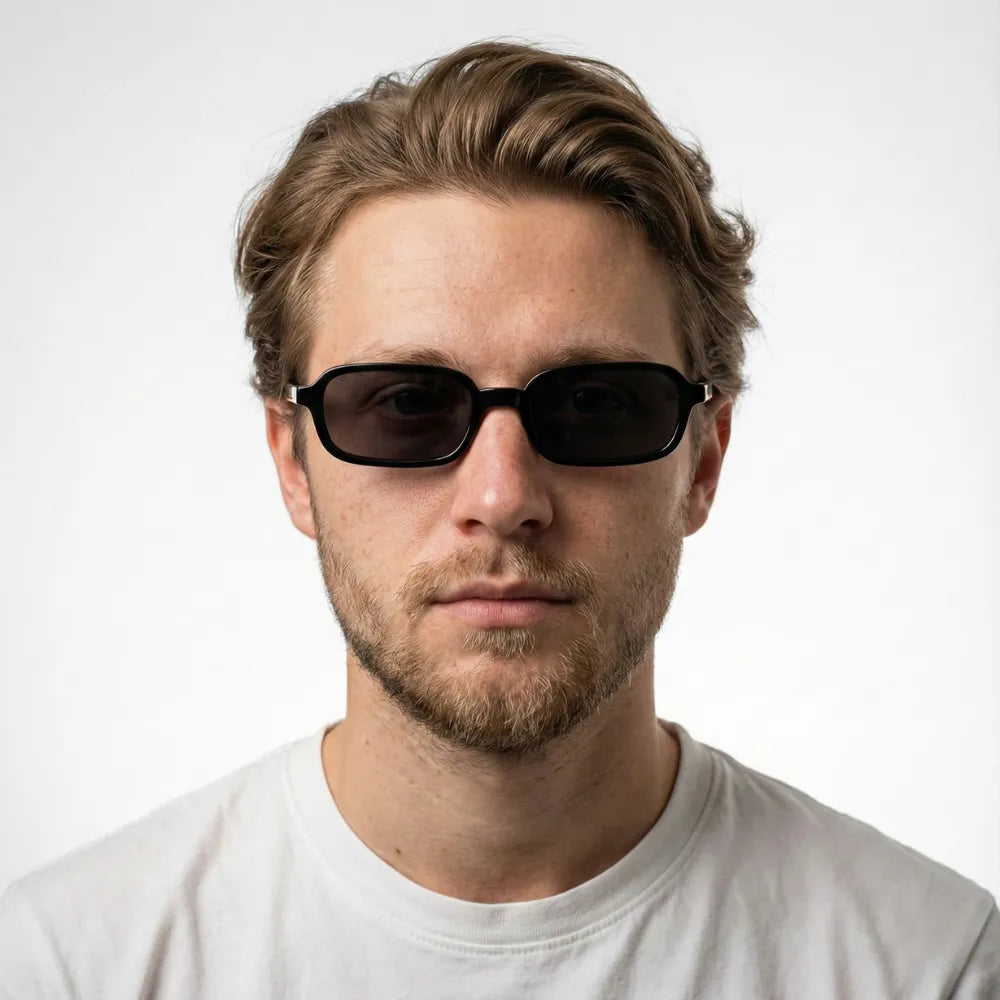 Narrow rectangular sunglasses worn outdoors — HARO Amalfi Sails lifestyle